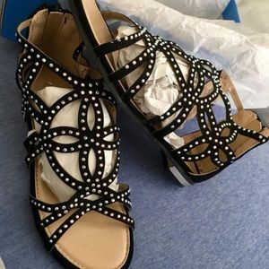 Black sandals with silver accents